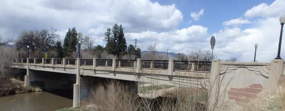 A wide shot of the Cache La Poudre bridge over Monument Creek