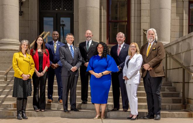 2025 City Council group photo on the steps of City Hall. From left to right: Nancy Henjum (District 5);  Brandy Williams (District 3); Roland Rainey (District 6); Brian Risley, President Pro Tem (At Large);  Dave Donelson (District 1);  Kimberly Gold (District 4); Tom Bailey (District 2); Lynette Crow-Iverson, President (At Large); David Leinweber (At Large)