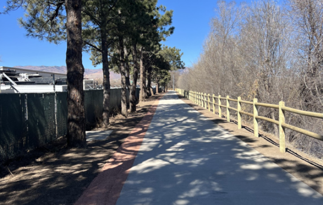 Pikes Peak Greenway after the work done on it, with a freshly paved sidewalk.