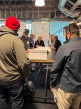 Community members engaging with the community meeting regarding N. Stone Street